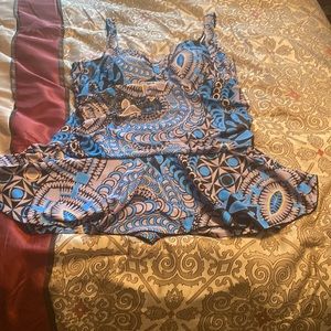 1 piece swimsuit with shorts and skirt